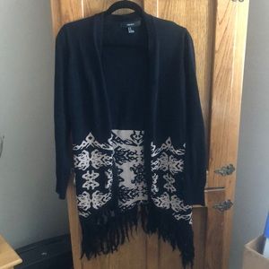 Black thigh length sweater with tassels